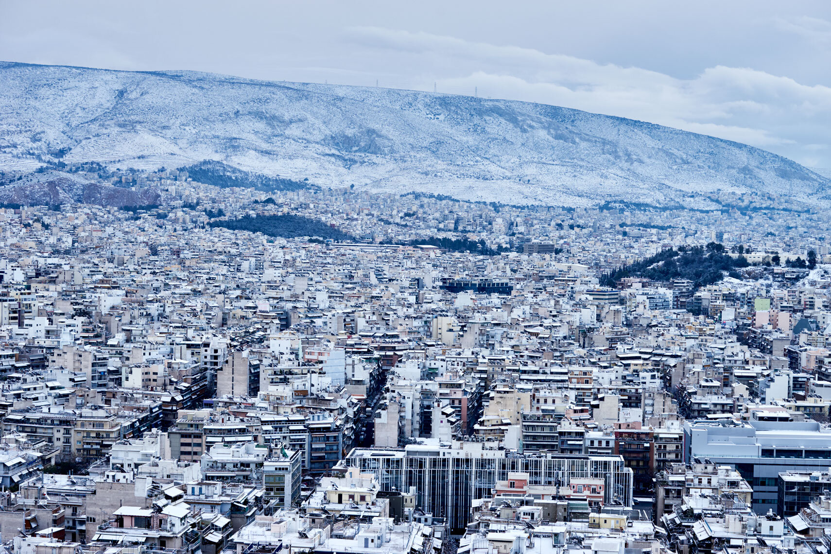 Athens in the snow captured from Filopappou Hill