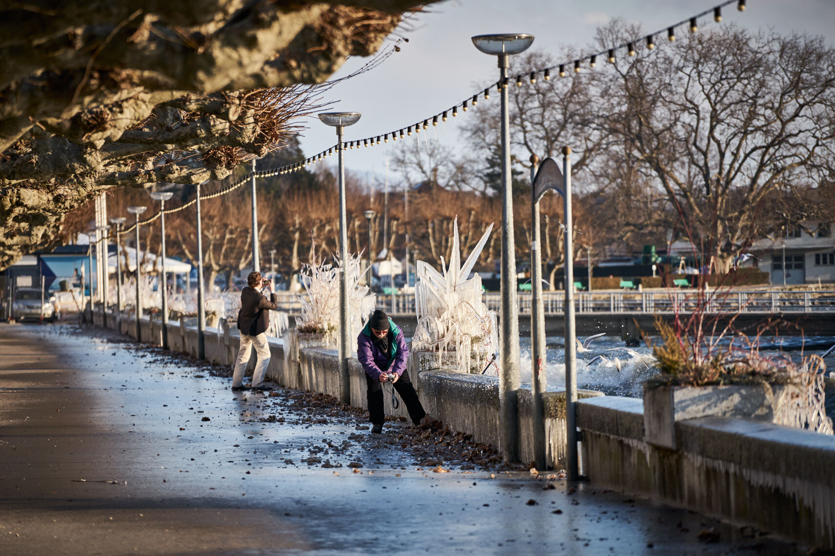 ice cold | people photograph ice in nyon during winter storm