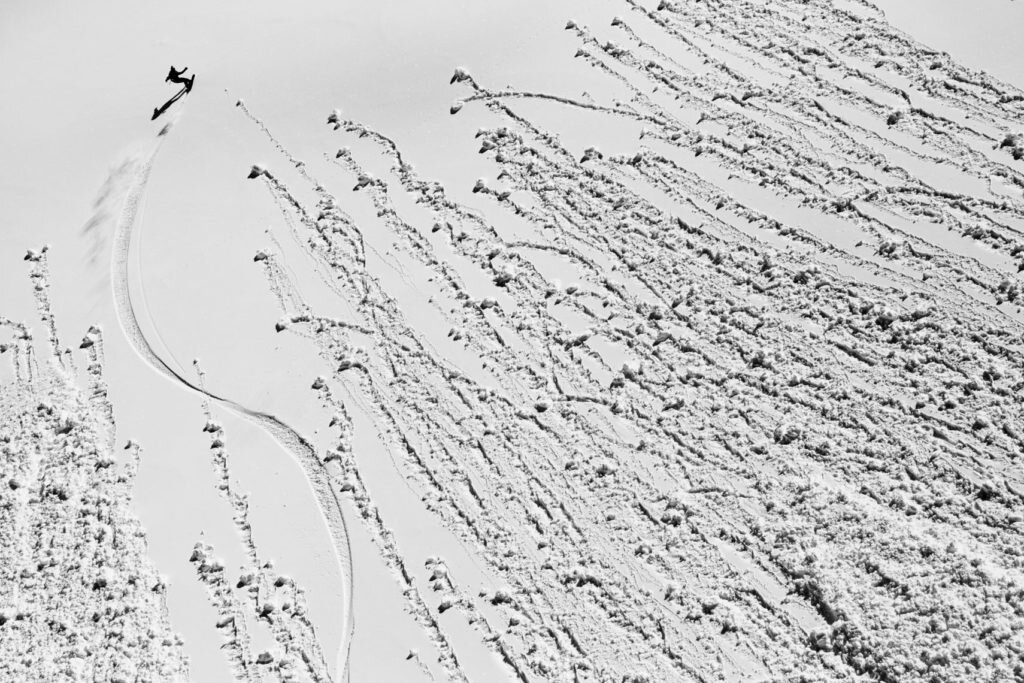 a snowboarder rides through the roller balls